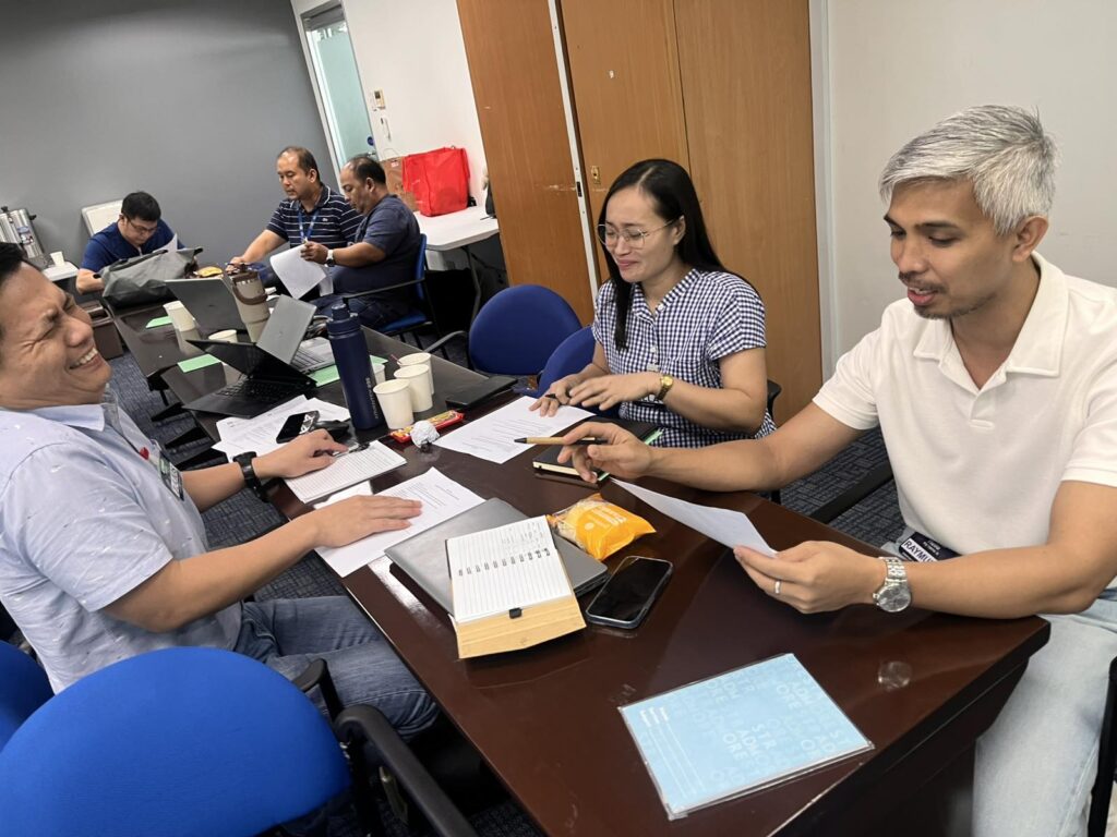 Managers seated together in discussion, engaged in conversation
